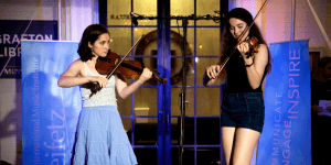 Two girls playing violin in Staunton, VA