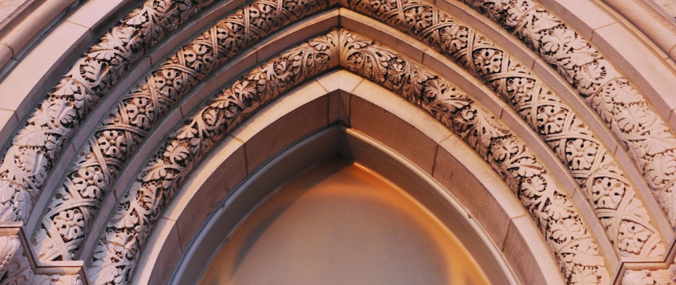 An up close view of intricately etched arches from the entrance of a church in Staunton Virginia. 