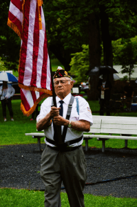 A veteran holding the american flag in Staunton, VA during the Independence Day Celebration