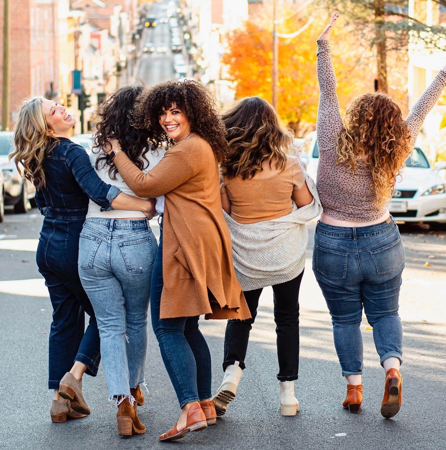 5 women smiling together in downtown Staunton, Virginia