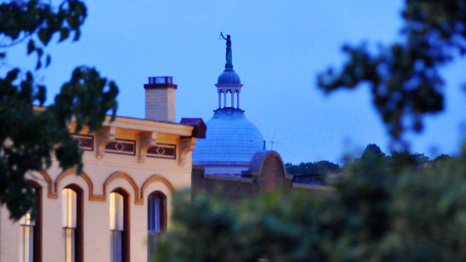 A Bronze Statue Of Lady Justice With Scales Above The Augusta County Courthouse Building In Staunton Virginia. 