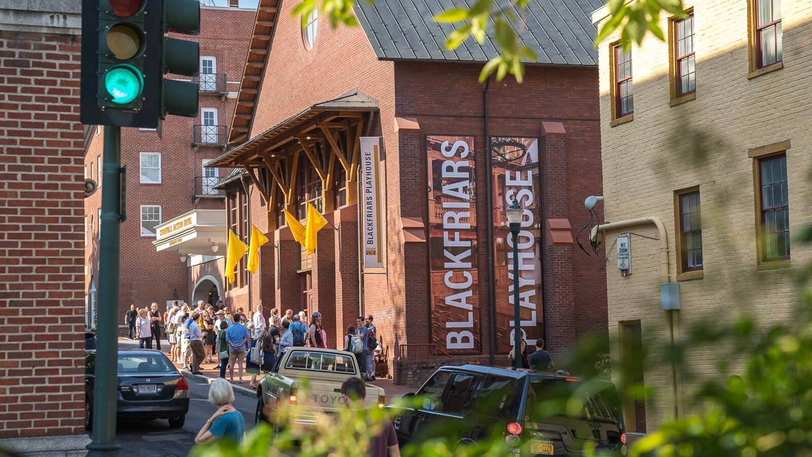 A crowd of people gather outside of the Blackfriars Playhouse in Staunton Virginia