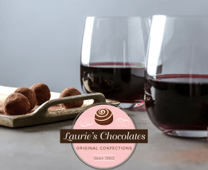 Wine and Lauries Chocolates close up on a table