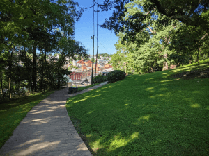 Walking trail in Staunton VA that has large trees and a brick pathway