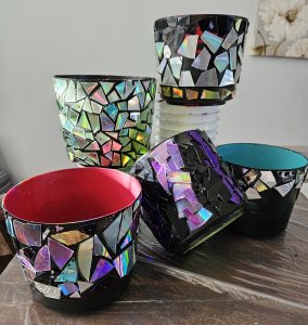 Planters that are designed to resemble disco balls, arranged in various shapes and sizes