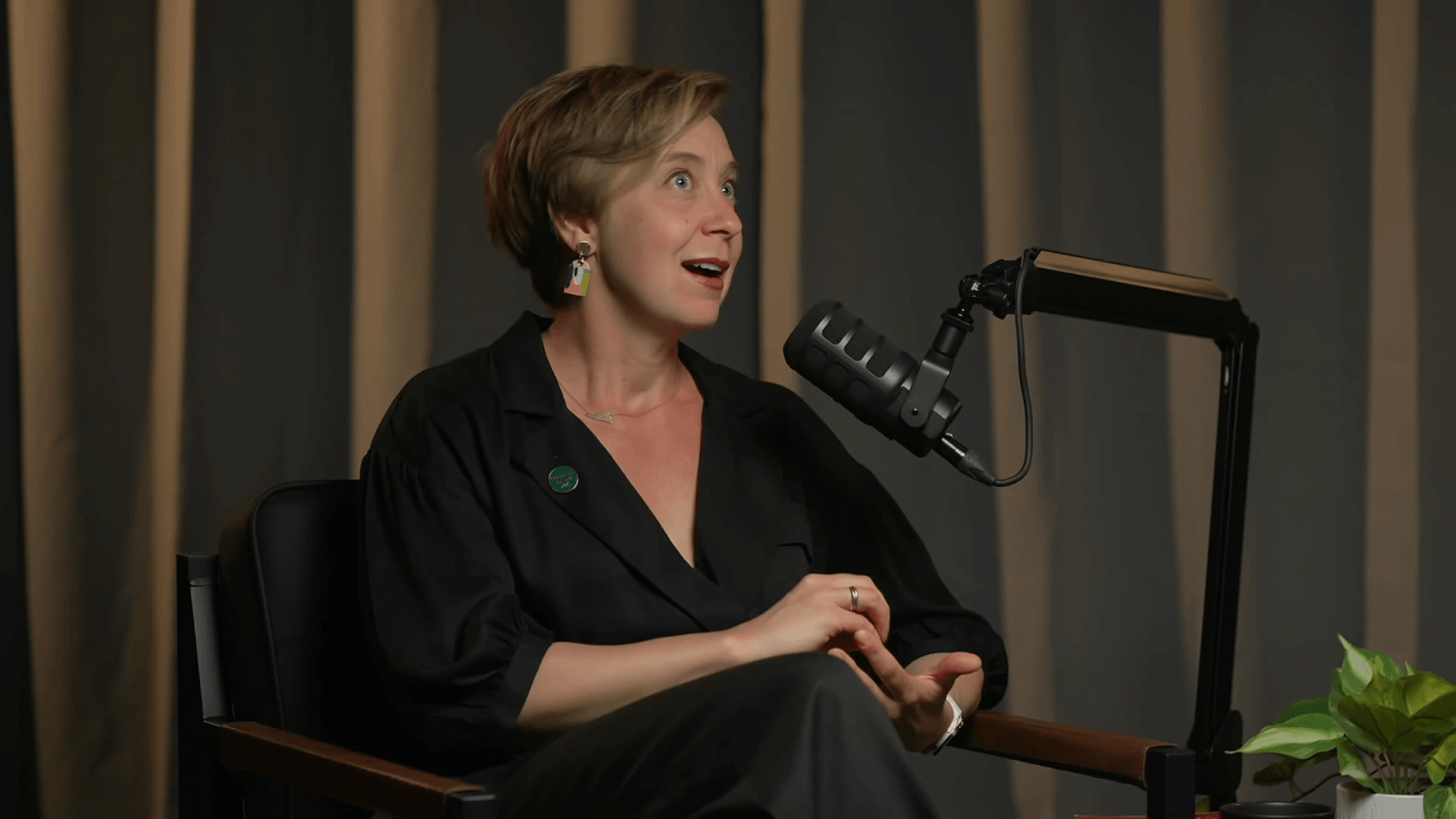 Anika, short blonde hair, speaks into the microphone