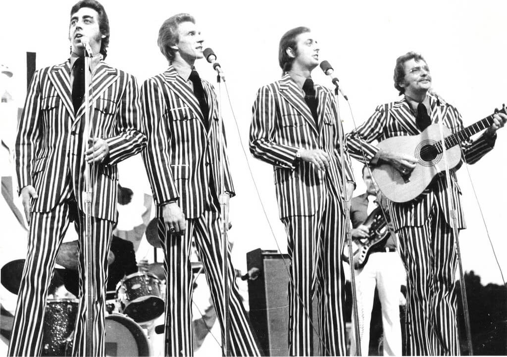 The Statler Brothers performing in pinstripe suits